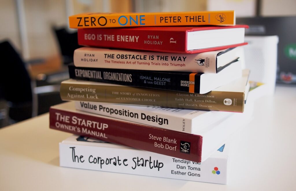person reading book comfortably at home