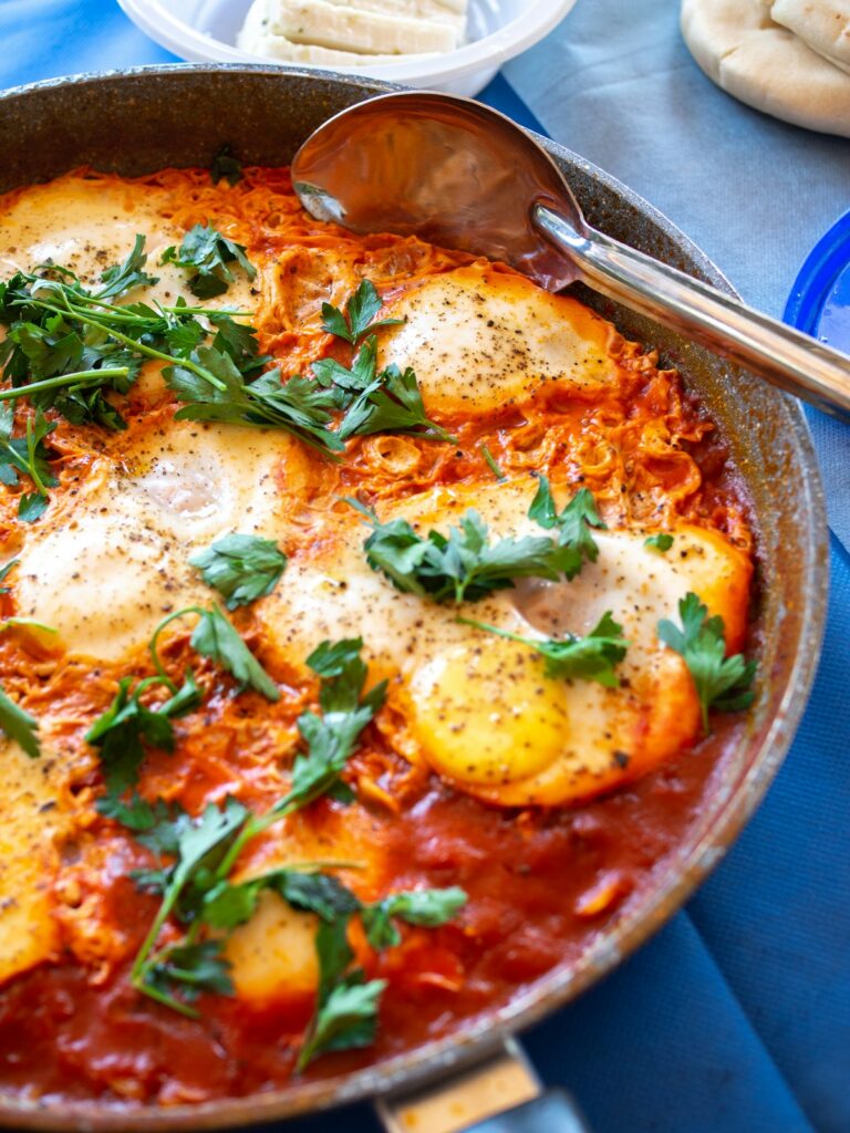 shakshuka eggs in spiced tomato sauce pan